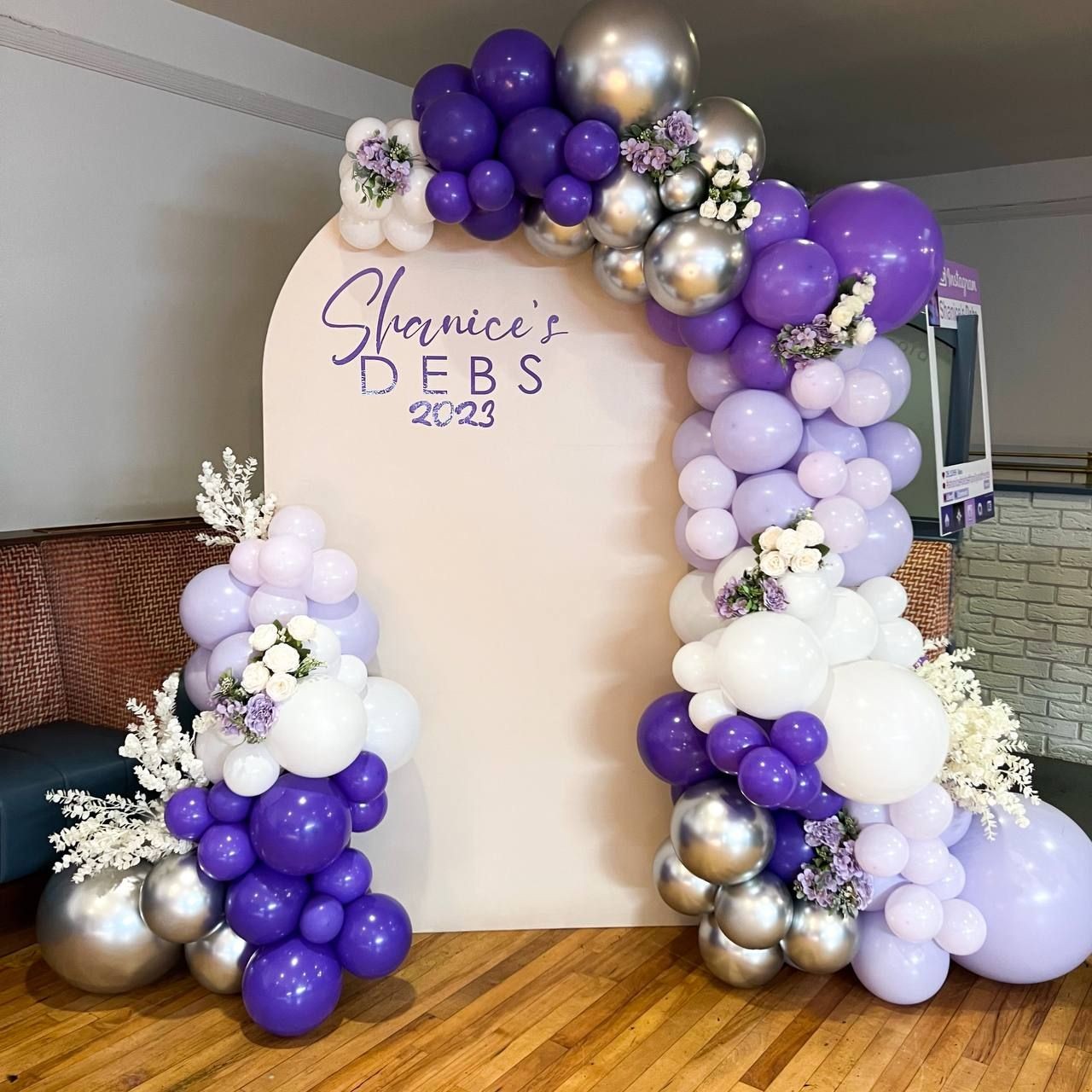 sail board backdrop with balloon arch and personalised text